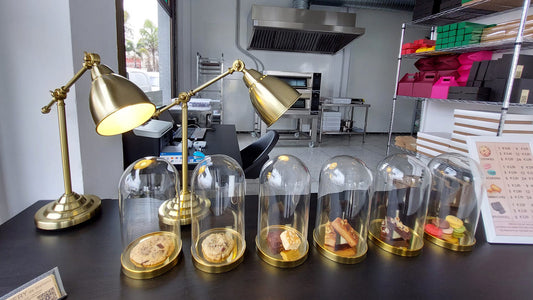 table with pastries in glass domes